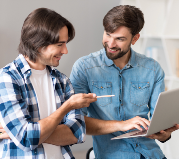 Guys looking at laptop
