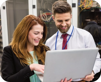 Two people looking at security performance on a laptop